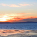 Sun setting over a receding tide by jenbo