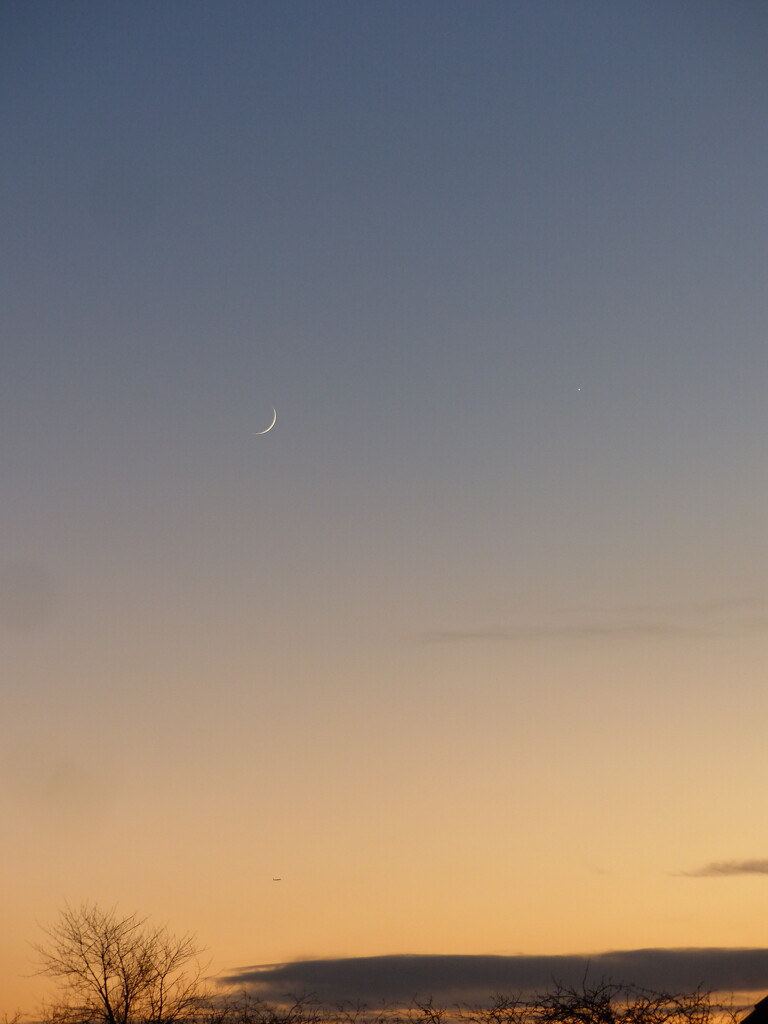 Waxing crescent, Venus and a aircraft taking off from London by jokristina