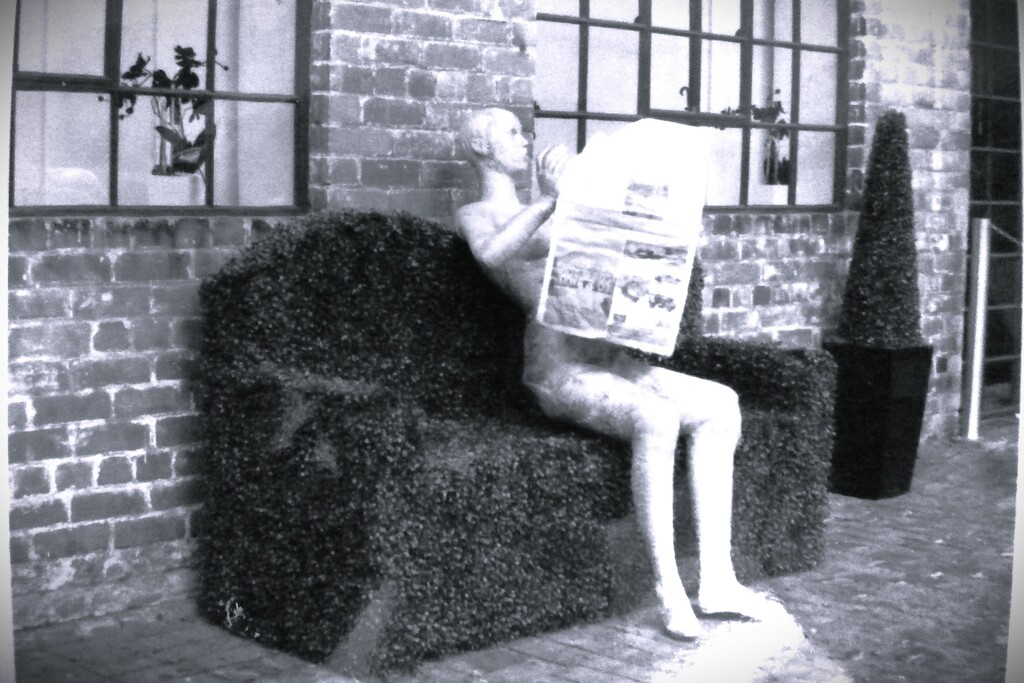 A mannequin reading the paper by beryl