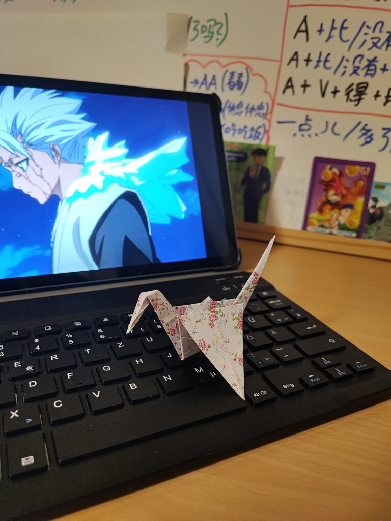 Doing origami while watching Bleach by nami