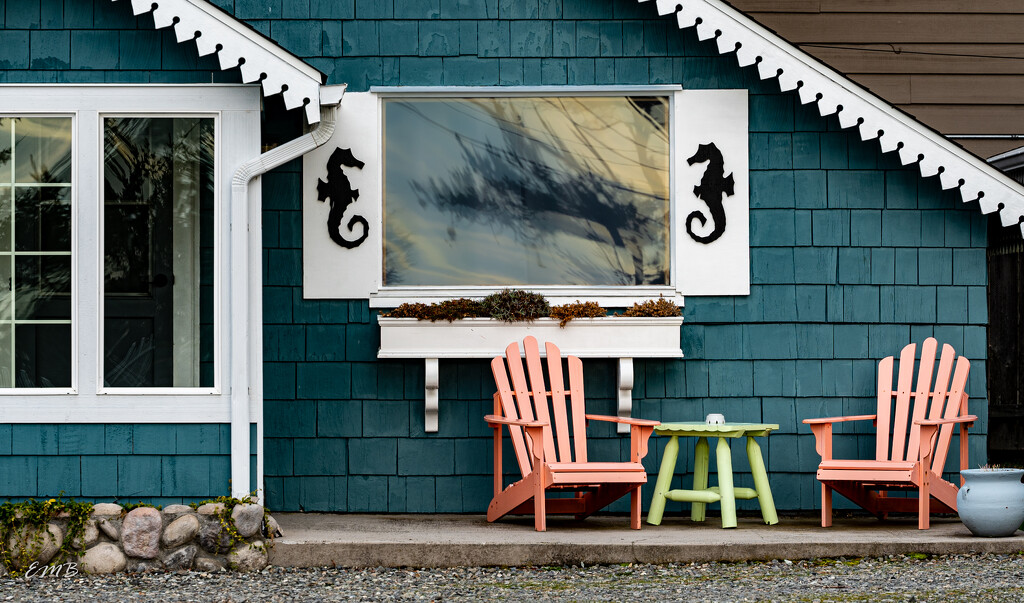 Porch chairs at seaside cabin by theredcamera