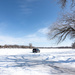 First Day of Spring: SUV on a Frozen Lake by tosee