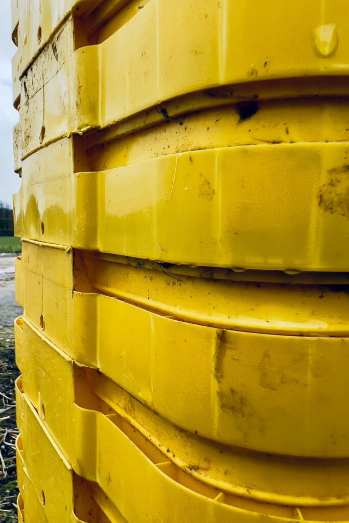 Stack of empty Yellow tubs by catangus
