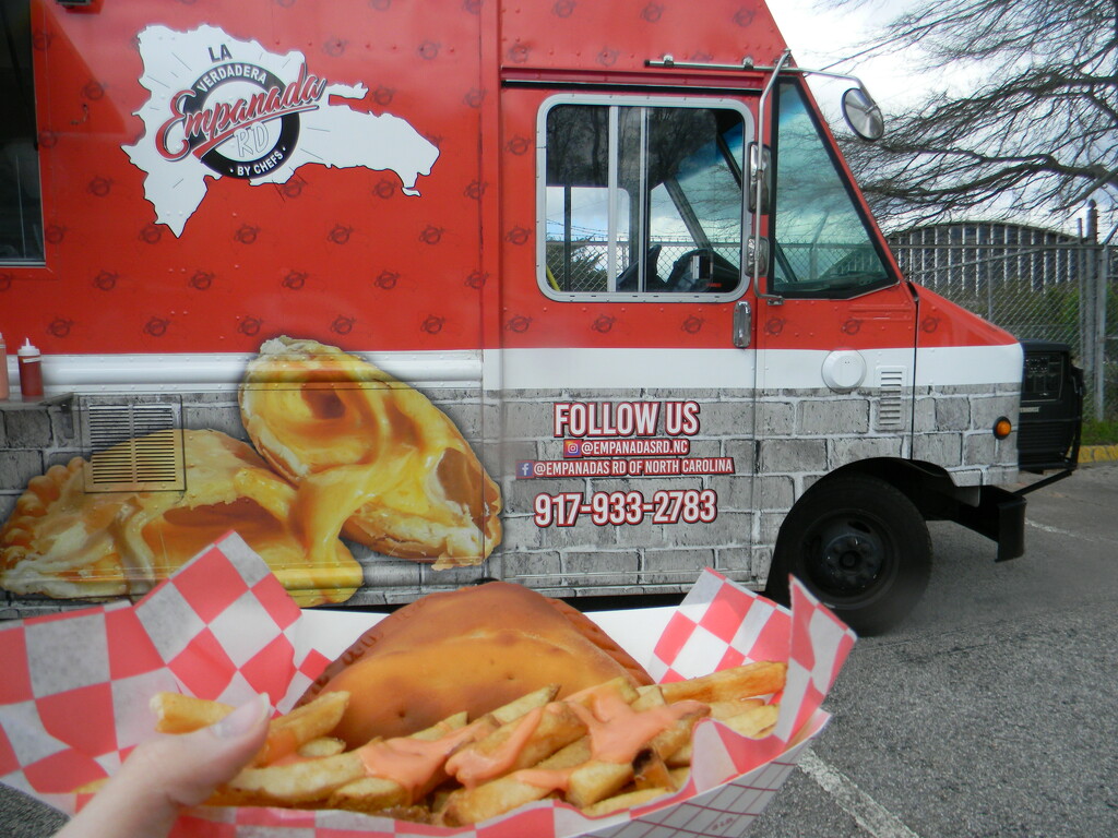Empanada and Fries In Front of Truck by sfeldphotos