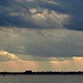 Cloud layers and sunbeams over the harbor  by congaree