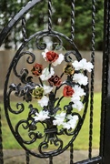 16th Apr 2023 - Flowers on a wrought iron gate………730