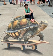 23rd Apr 2023 - Lori riding a chalk art 3-D turtle! 