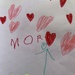 It says “mom” in danish by lily