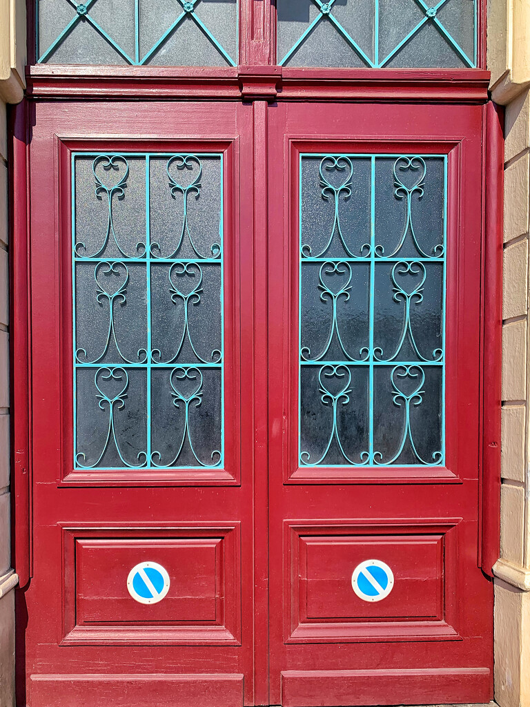 12 hearts on a red door.  by cocobella
