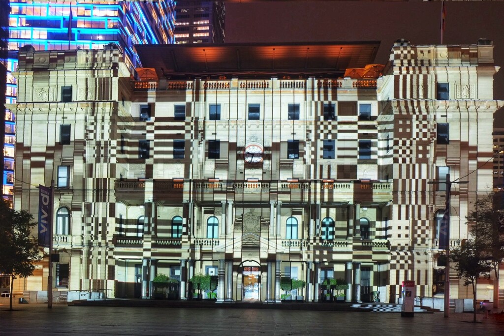 The SydneyVivid light show. This is an old sandstone building on the harbour front, Customs House.  by johnfalconer
