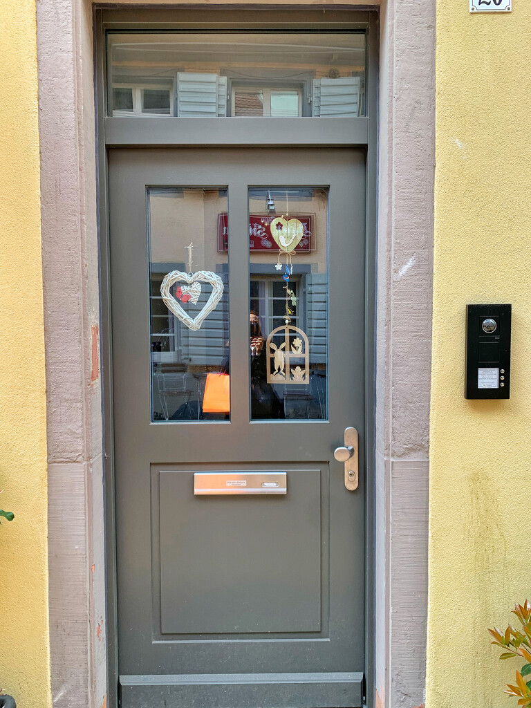 Hearts on grey door.  by cocobella