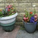 Four floral flowerpots. by grace55