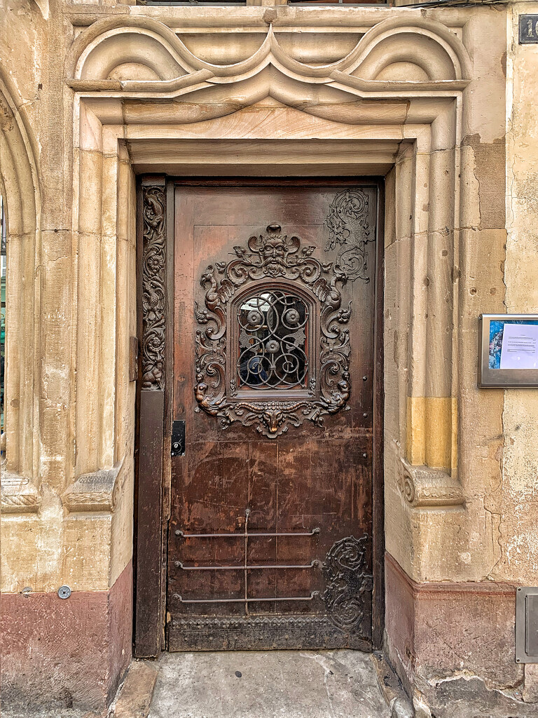 Reverse heart on an ancient door.  by cocobella