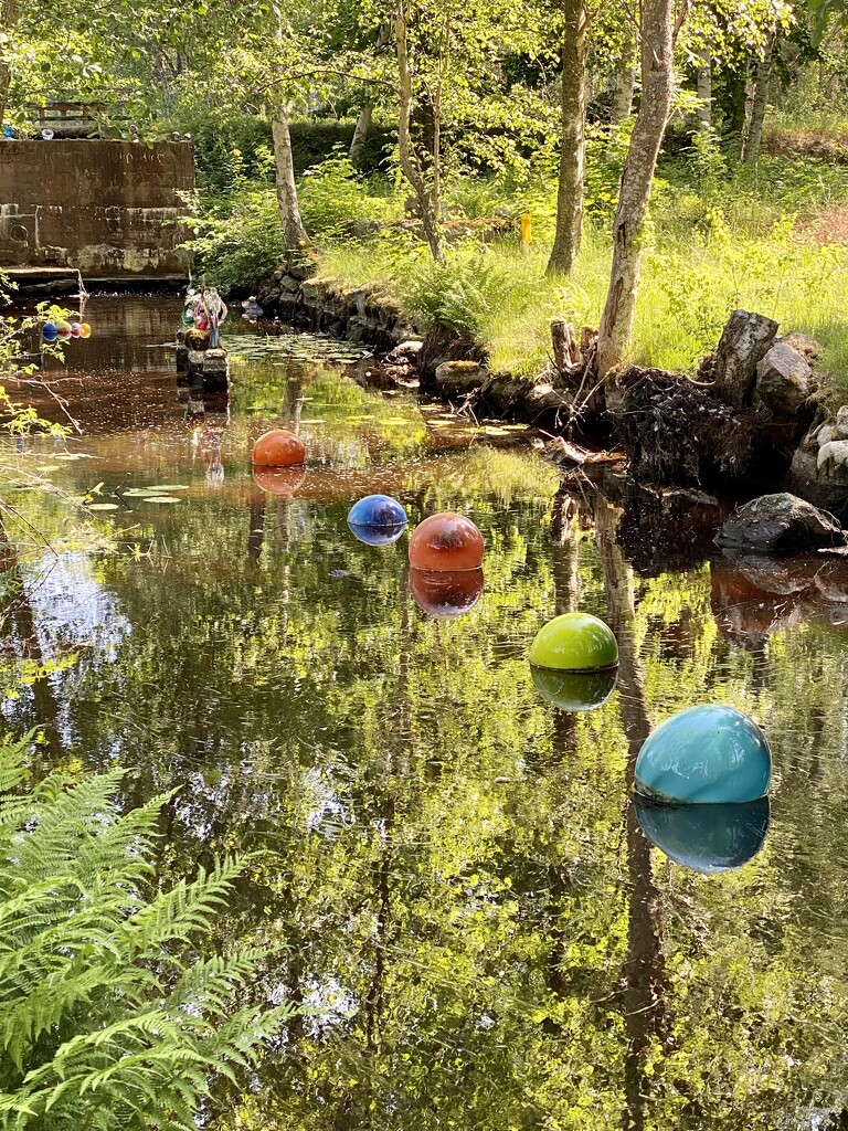 Glass Orbs in Stream by clay88
