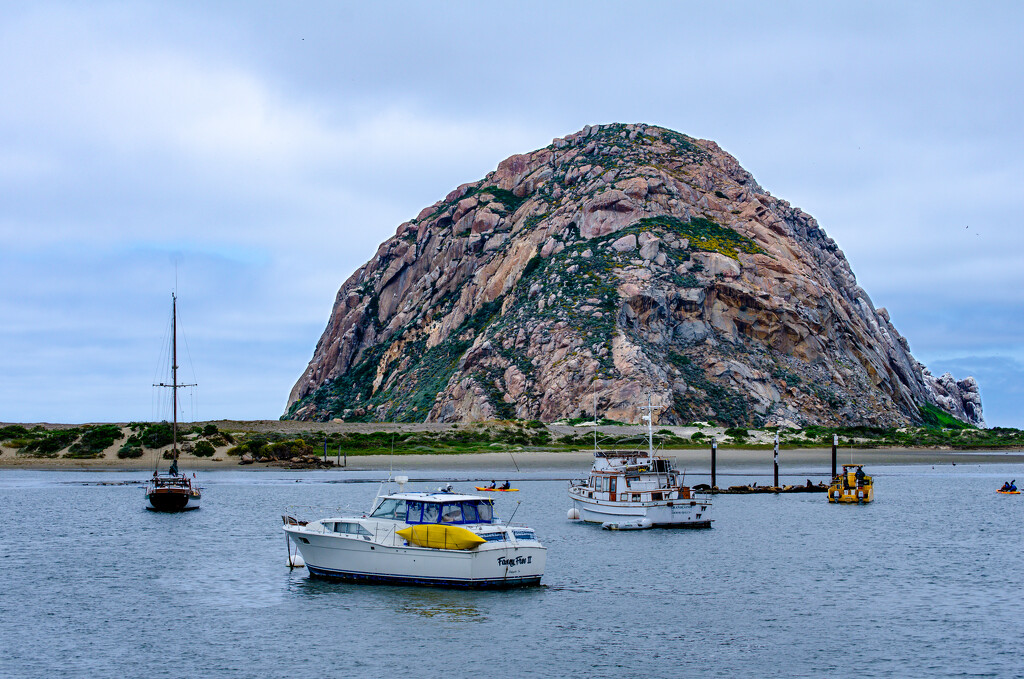 Boats anchor in sight of Morro Rock by ggshearron