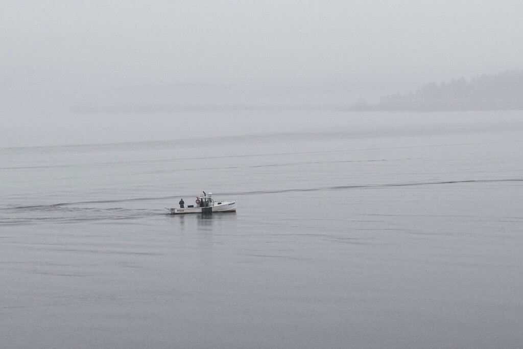 Lobster boat in the fog by berelaxed