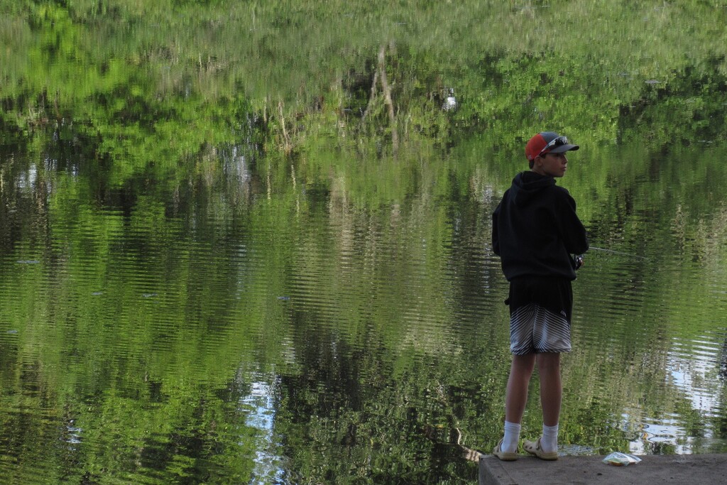 A Boy in a Red Cap Fishing in the Slough by granagringa