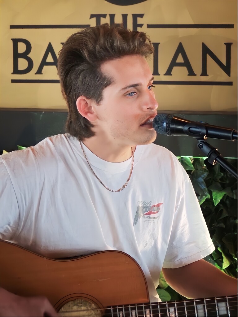 Young singer at Bavarian Restaurant at Manly Wharf.  by johnfalconer