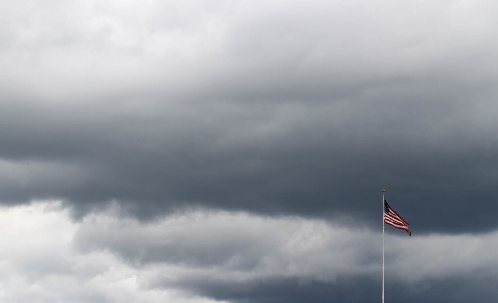Atmospheric sky with a flag by mittens