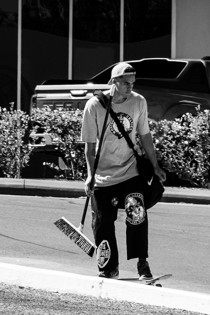 Skate boarder with broom by nannasgotitgoingon