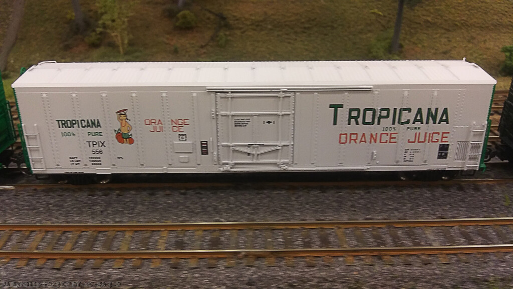 Tropicana Juice Train rolls by on North Main by byrdlip