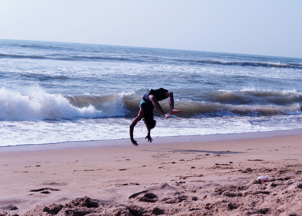 Somersault at beach by sudo