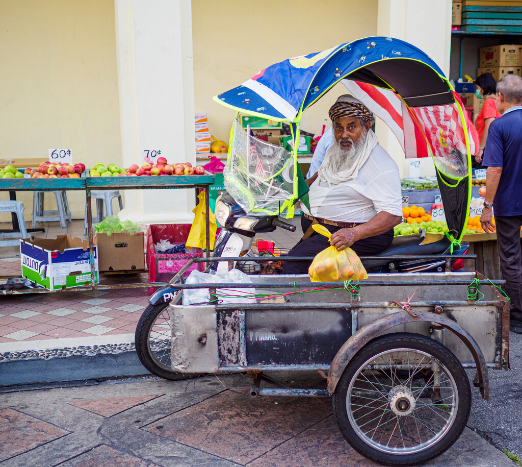 Indian Man Buying Fruit by ianjb21