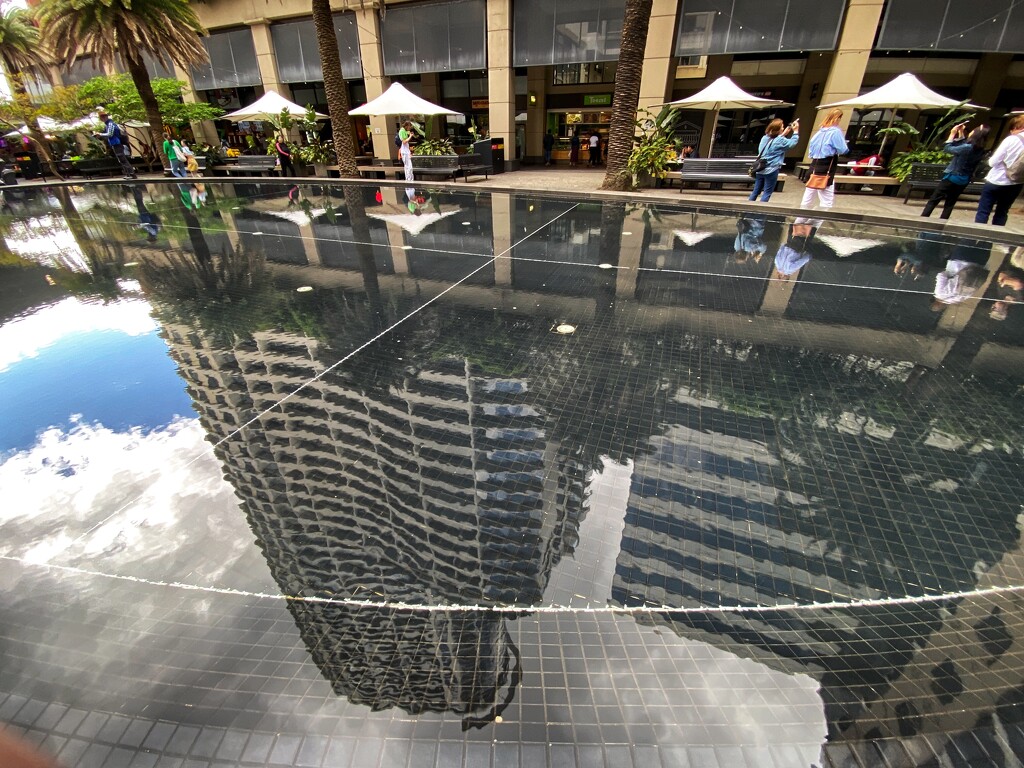Reflections of high rise living on St Leonards railway station, Sydney  by johnfalconer