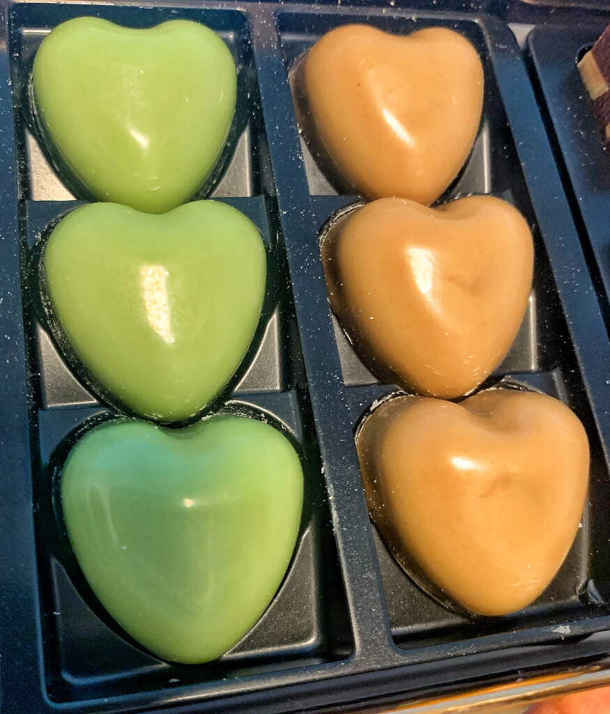 Green and orange chocolate hearts.  by cocobella