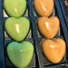 Green and orange chocolate hearts. 