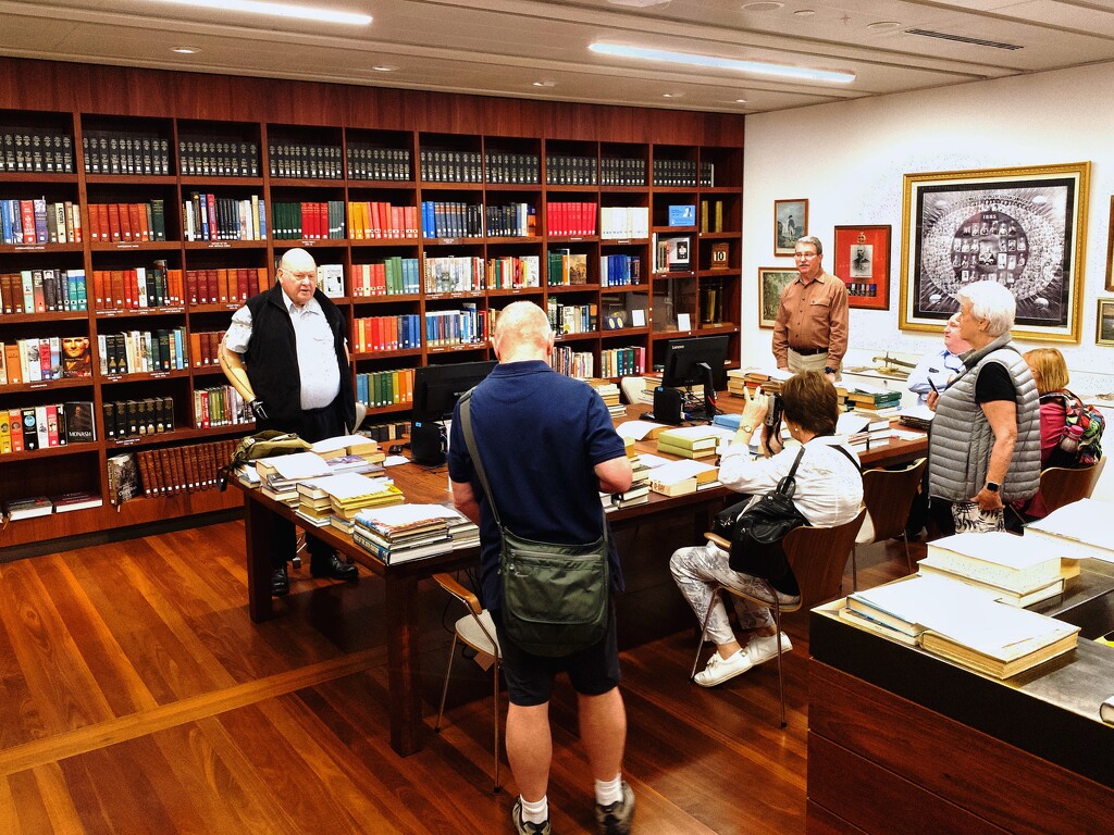 A veteran explains the workings of the library in the basement of the ANZAC War Memorial, Sydney.  by johnfalconer