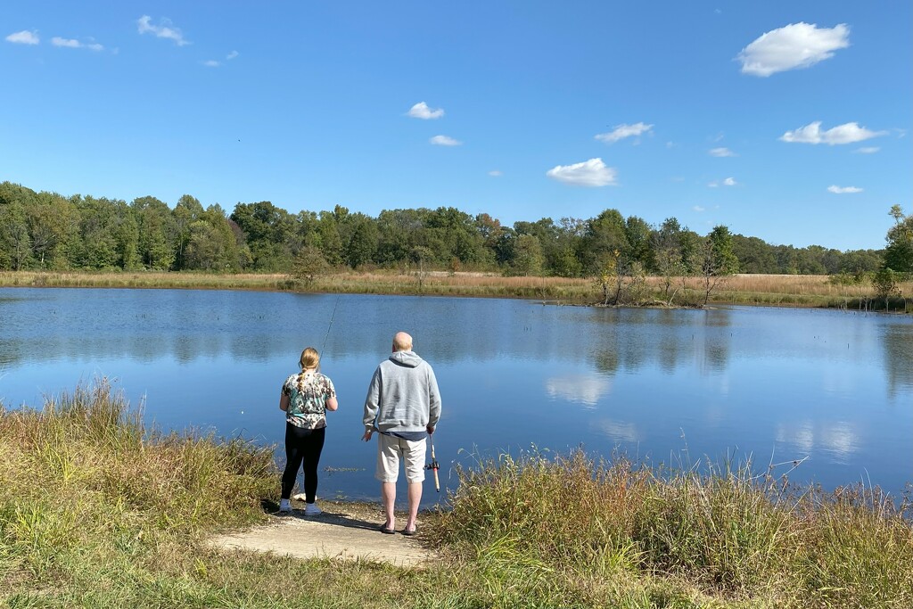 Father and daughter fishing by tunia