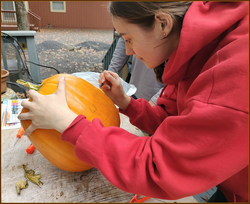 Carving a  Pumpkin by olivetreeann
