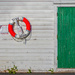 Lifebuoy and green door by helstor365