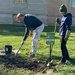 The mayor helps the Garden Club plant a tree by tunia
