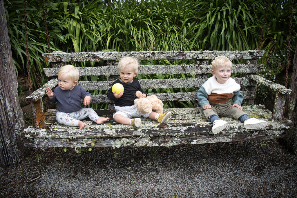 Cousins on a rocking garden seat by dkbarnett