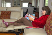 7th Nov 2023 - My wife checks out the recent AARP magazine while watching television