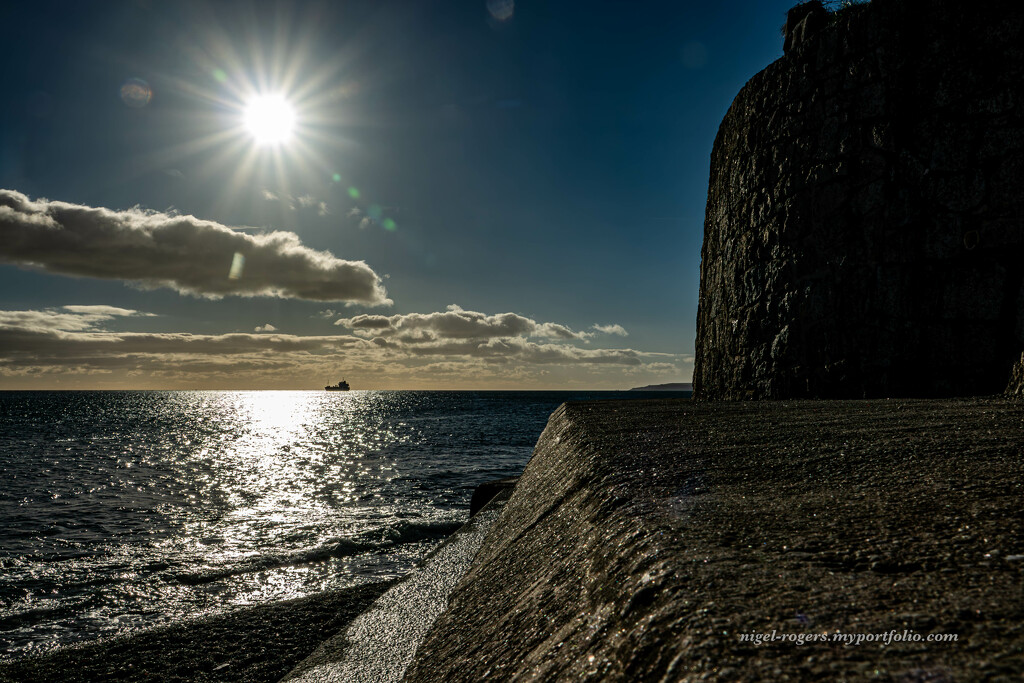 Looking along the sea wall by nigelrogers