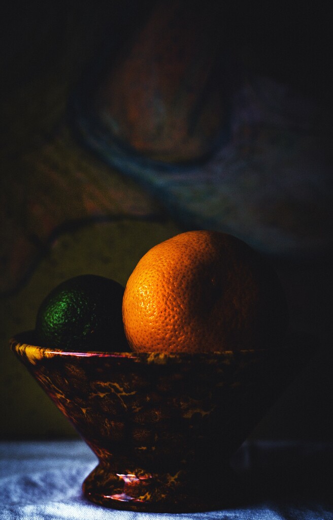 Mandarin and lime in bowl by nannasgotitgoingon