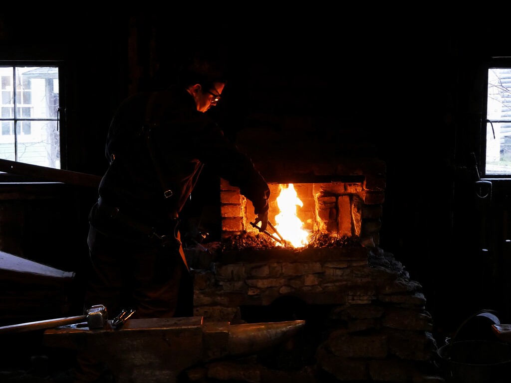 Blacksmith at the forge by ljmanning