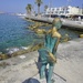 The young boy with the big fish, a bronze sculpture of Yiota Ioannidou by beverley365