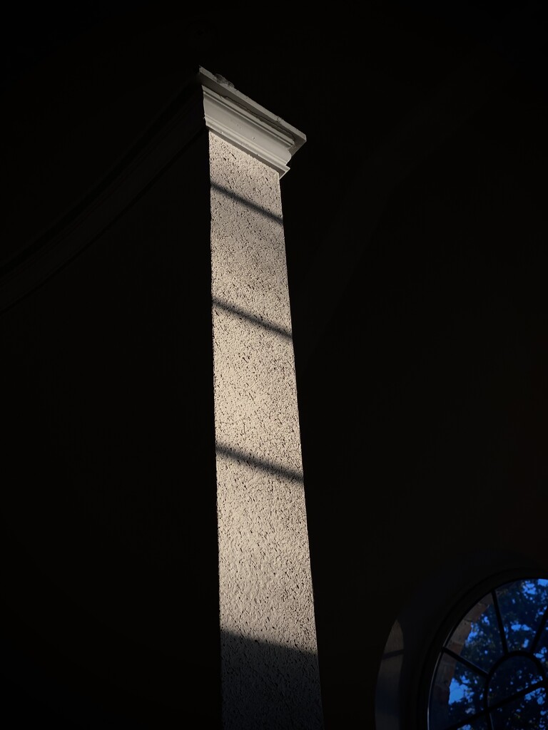 A column of light meets a column of drywall by aaronosaurus