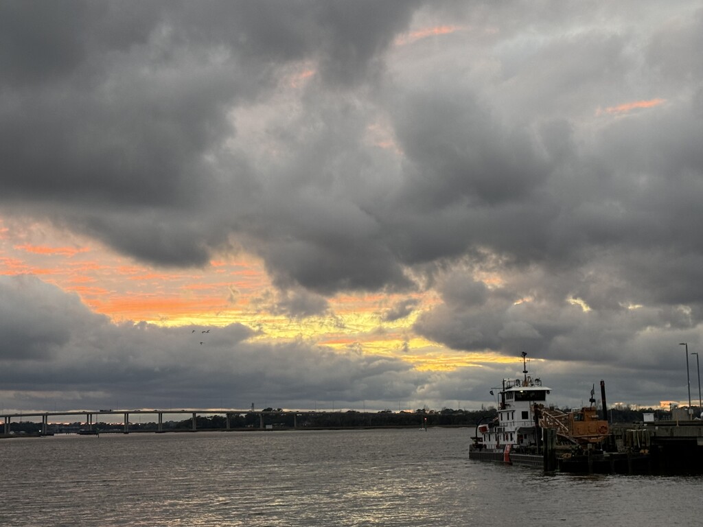 Tugboat and sunset over the Ashley River by congaree