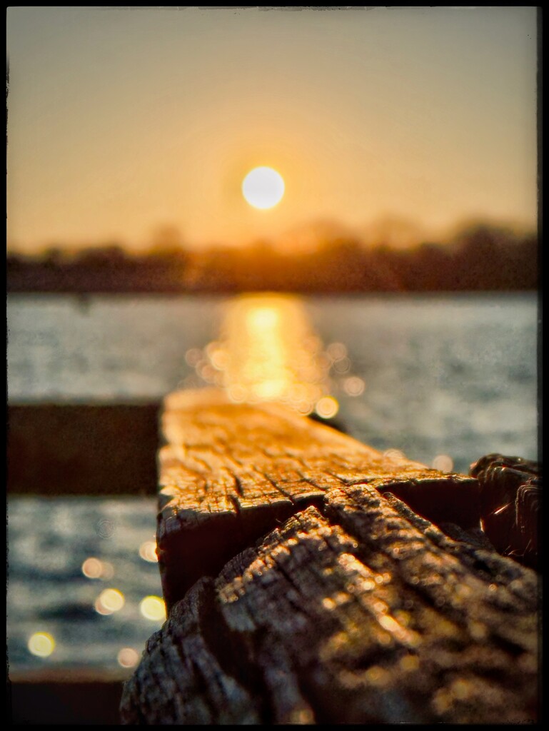The Sun Settles at the Edge of the Dock by eahopp