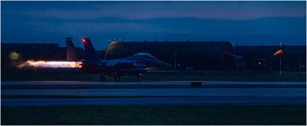 F 15 taking off in the black of night. by clifford