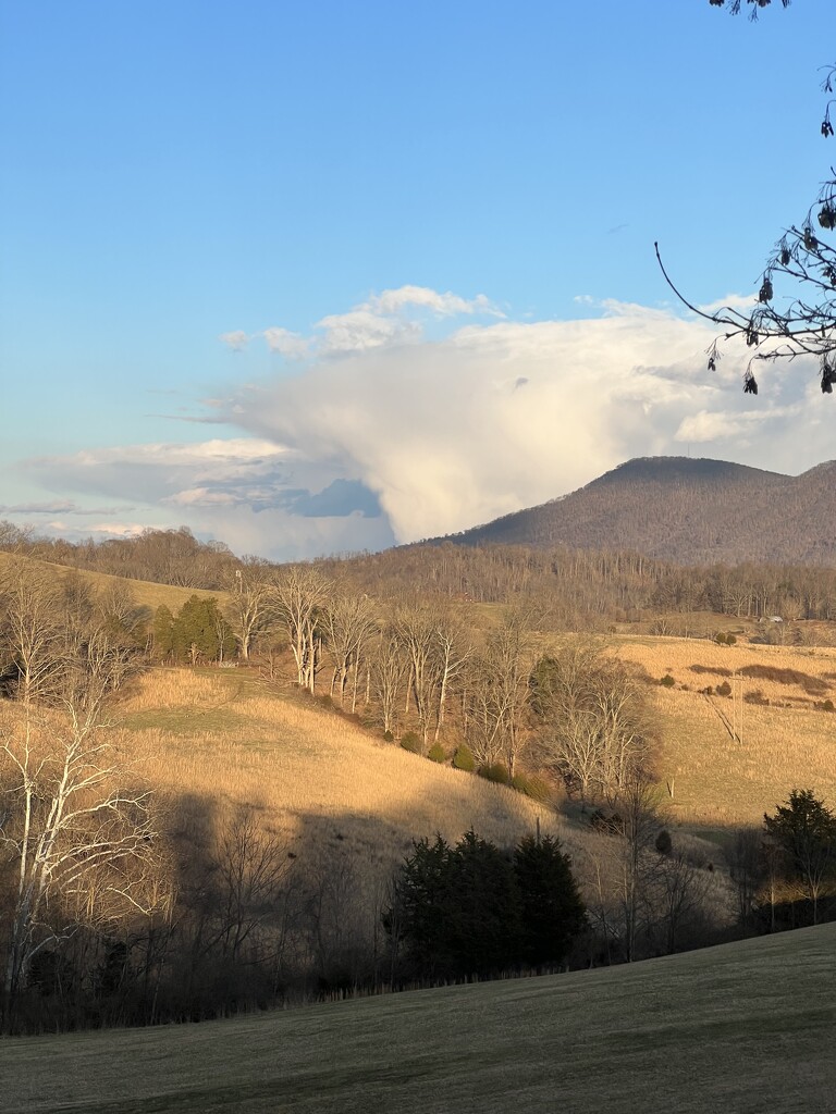 Cloud Emerging from Behind the Mountain by calm