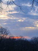 10th Feb 2024 - Dark clouds and a peek of the sun setting