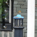 robin on a lantern bollard