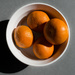 Just four oranges in the sun by cristinaledesma33