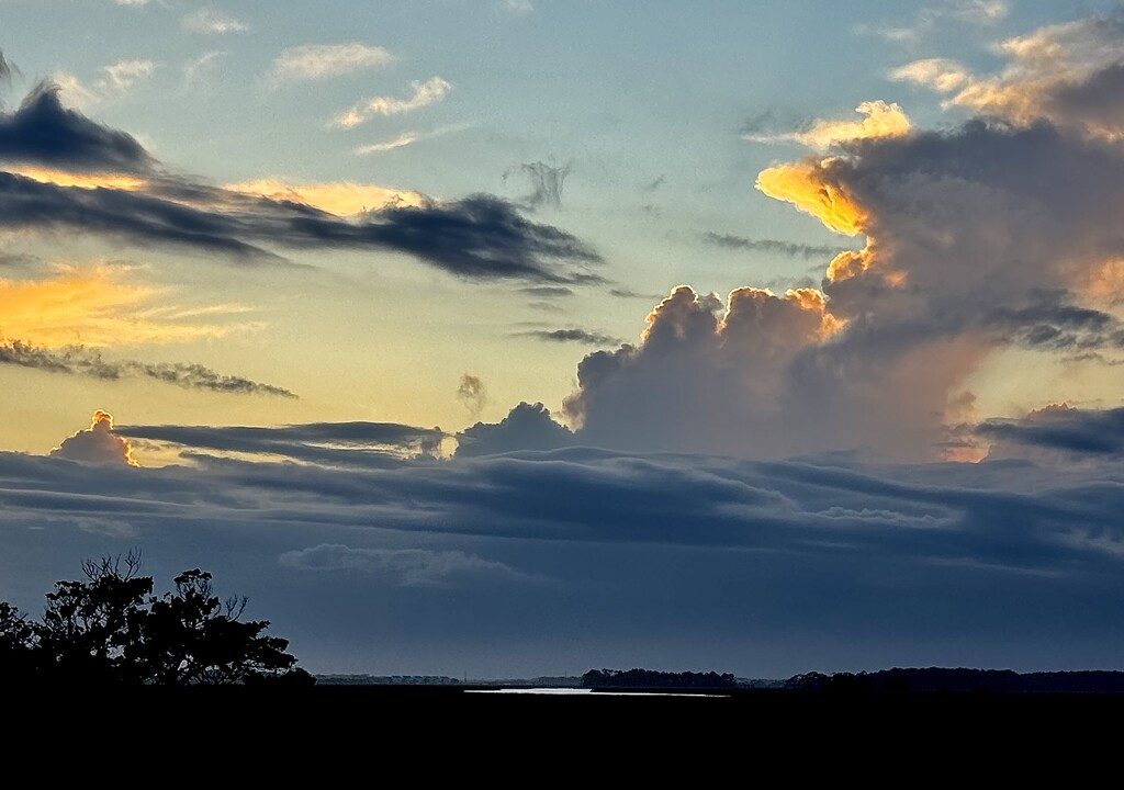 Sunset Clouds over the marsh by congaree